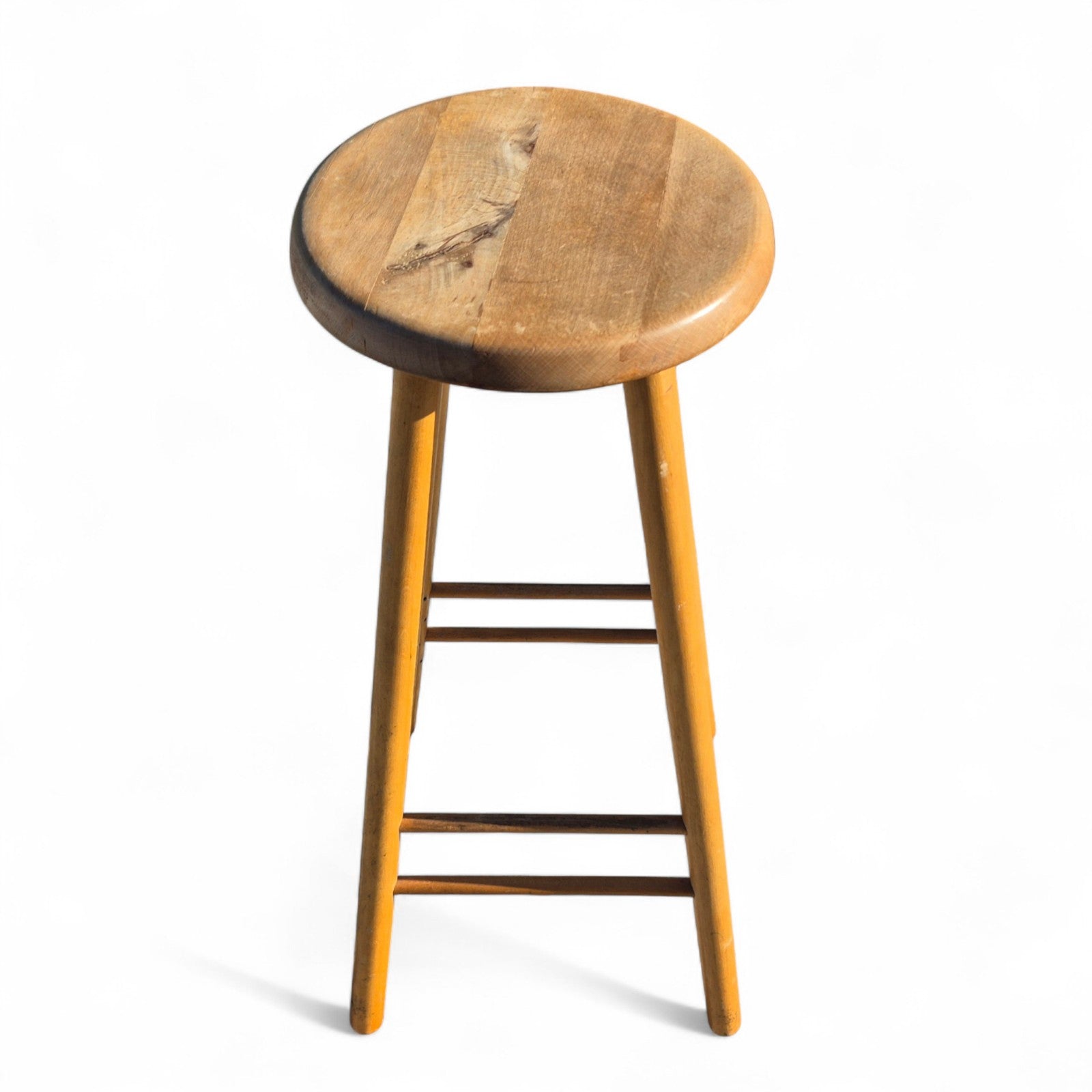 Vintage mid-century beech and elm kitchen stool with round elm seat and tapered legs – retro seating full of charm, ideal for rustic or modern interiors by Avego Antiques.