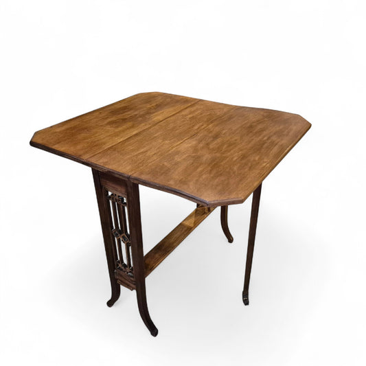 Antique mahogany Sutherland drop-leaf table with elegant Victorian design, cut-out end supports, and splayed legs on original castors – late 19th century by Avego Antiques.