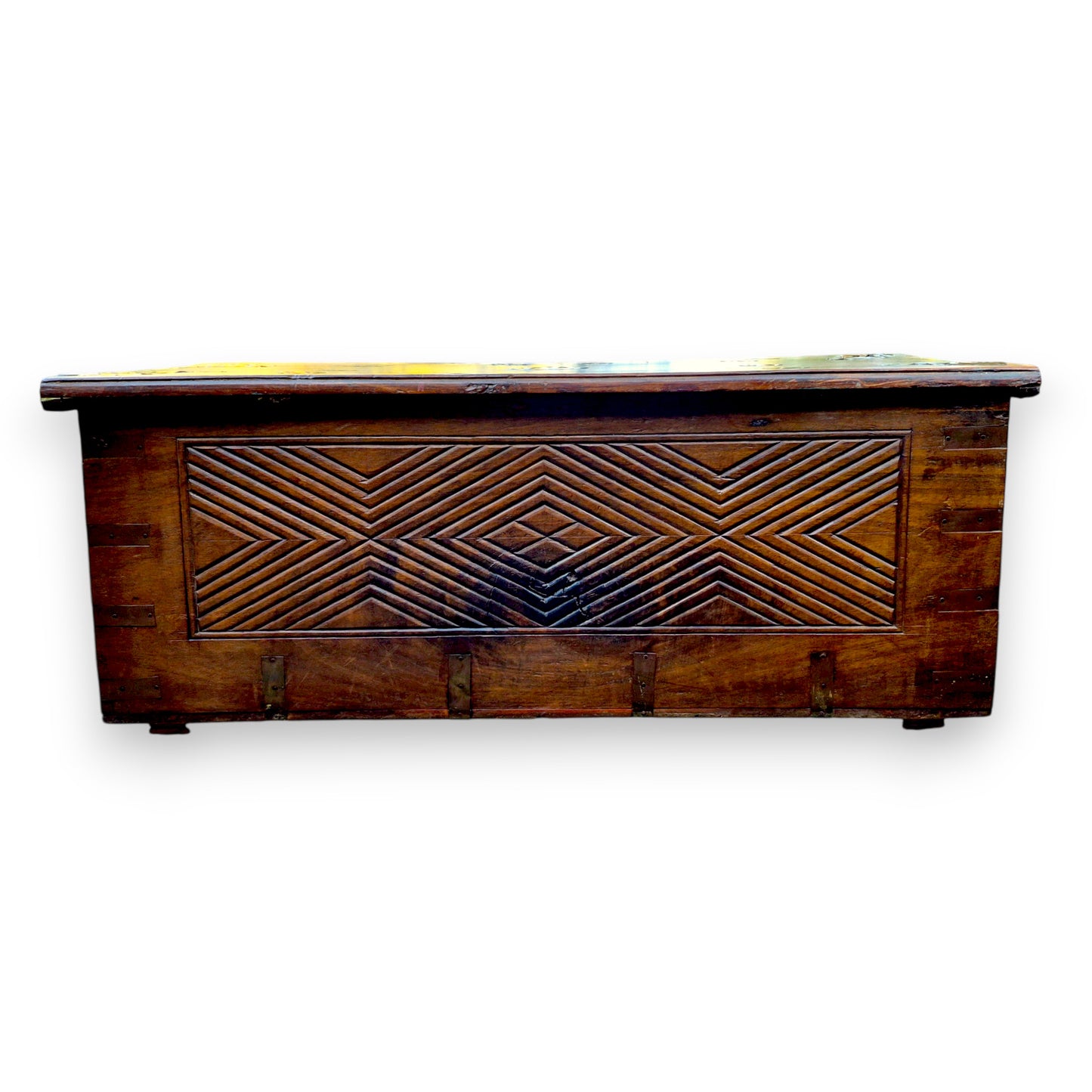 Rear view of antique padouk chest showing geometric carved panel