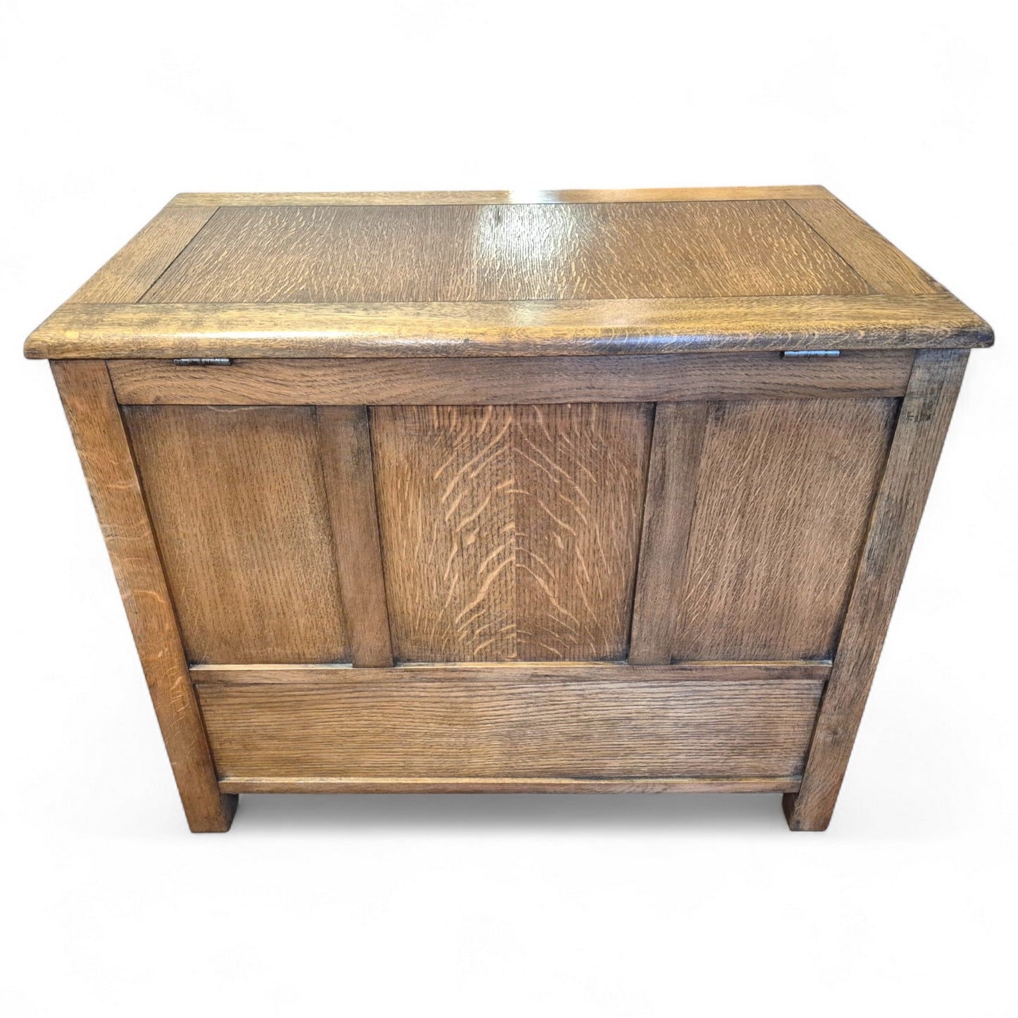 Close-up of linenfold carving and turned wooden knobs on vintage oak trunk