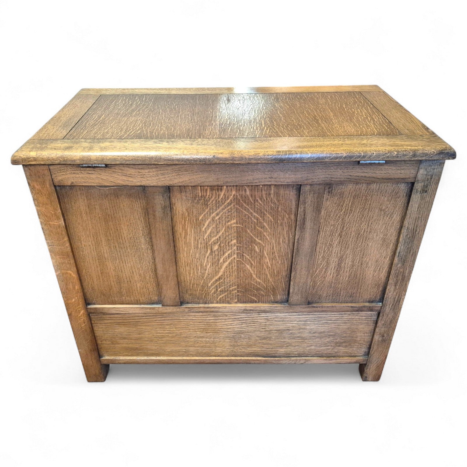 Close-up of linenfold carving and turned wooden knobs on vintage oak trunk