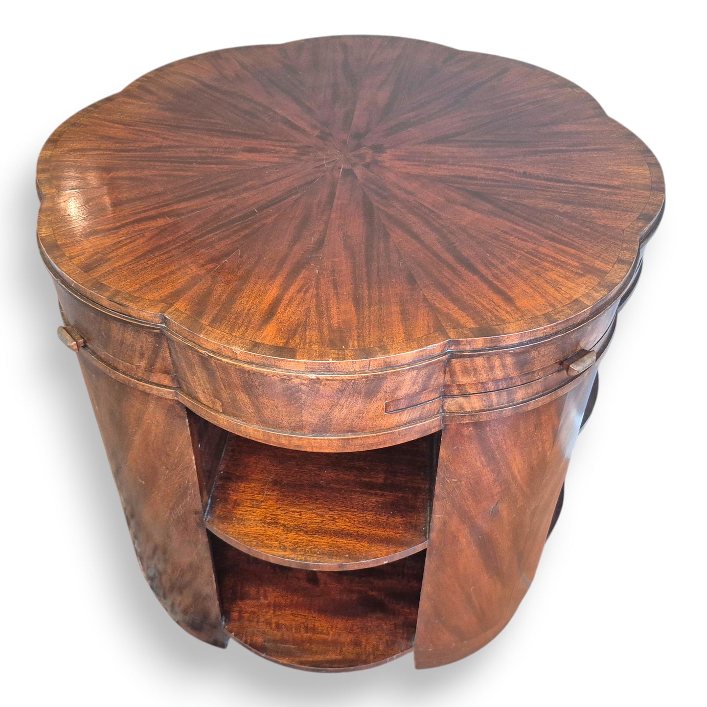 Art Deco coffee table with curved base and built-in open book shelves