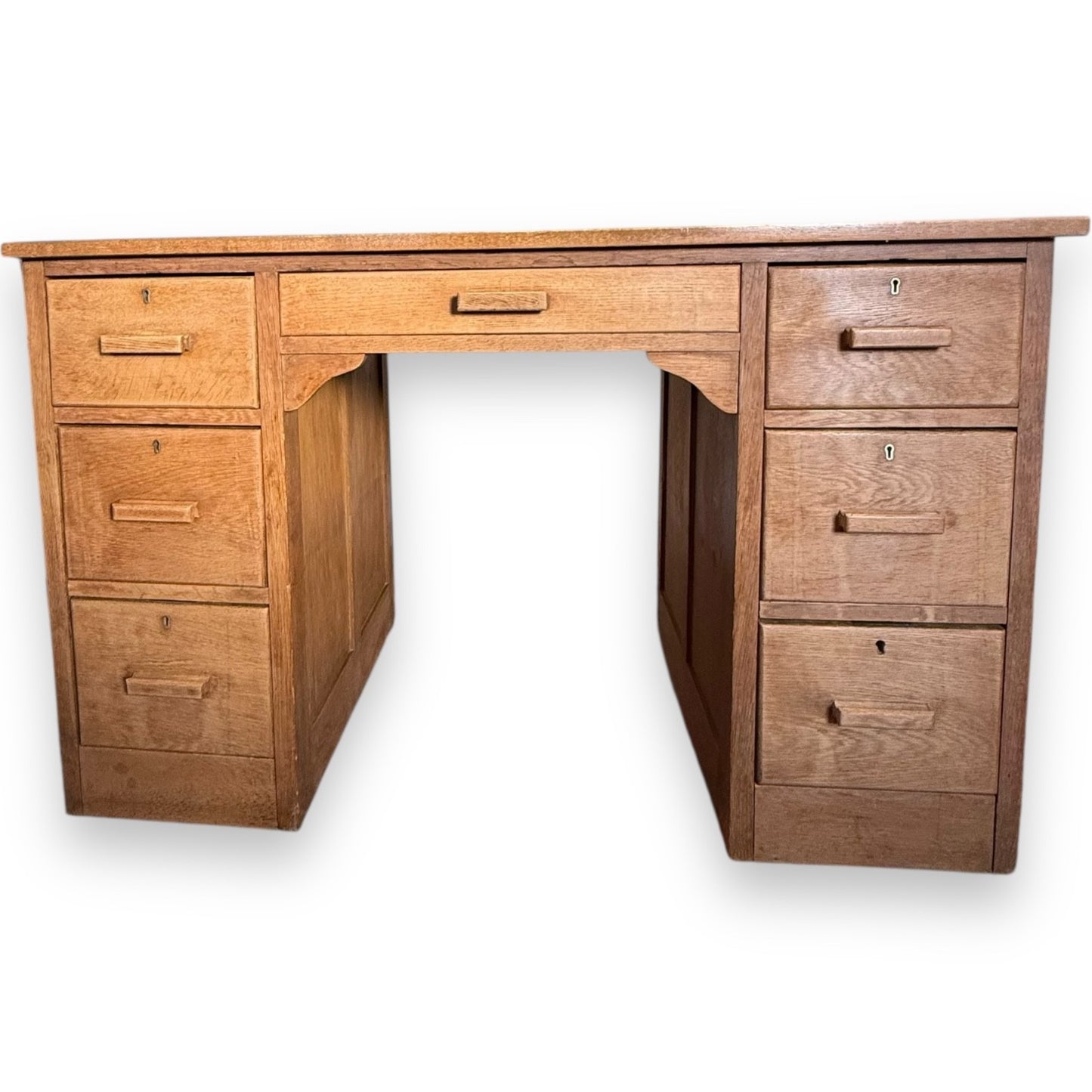 1930s Art Deco solid oak kneehole desk with seven drawers and original wooden handles – vintage home office furniture