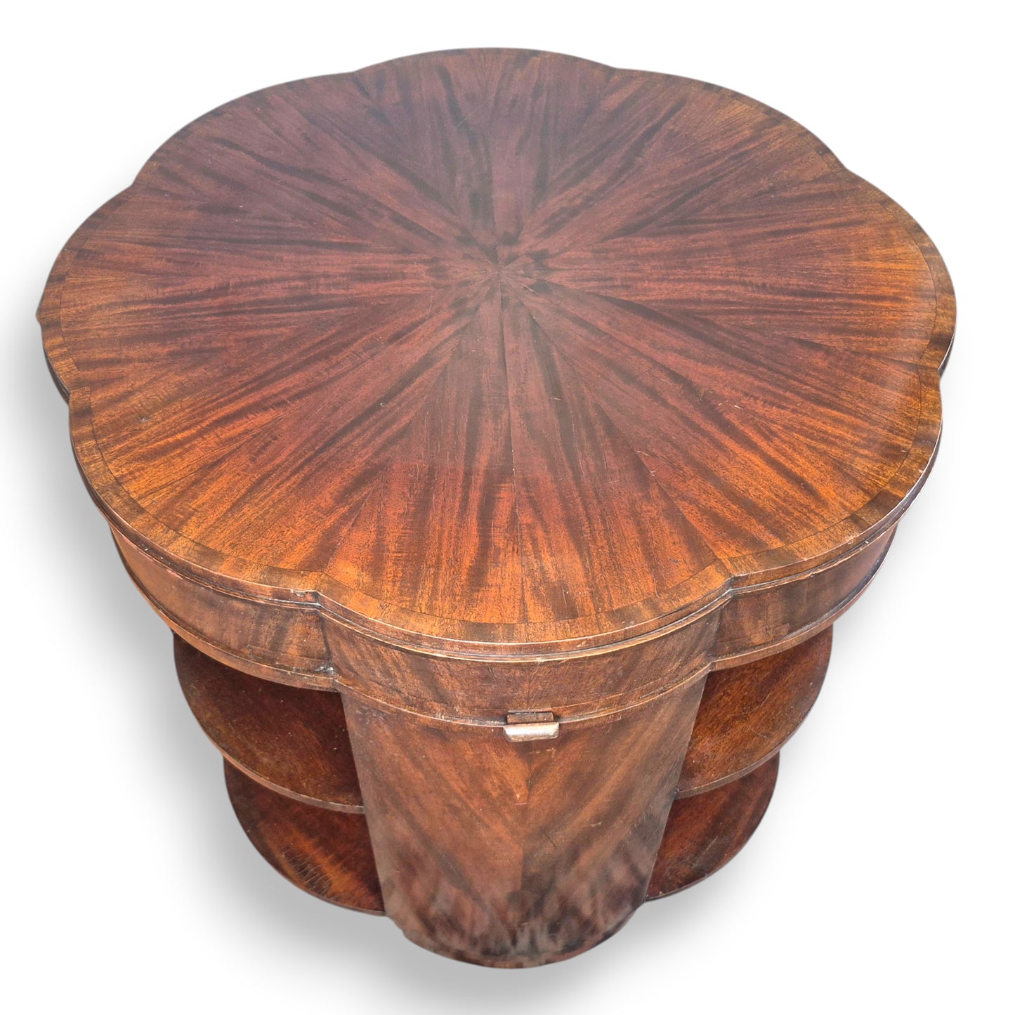 Flame mahogany sunburst veneer top on an Art Deco library table