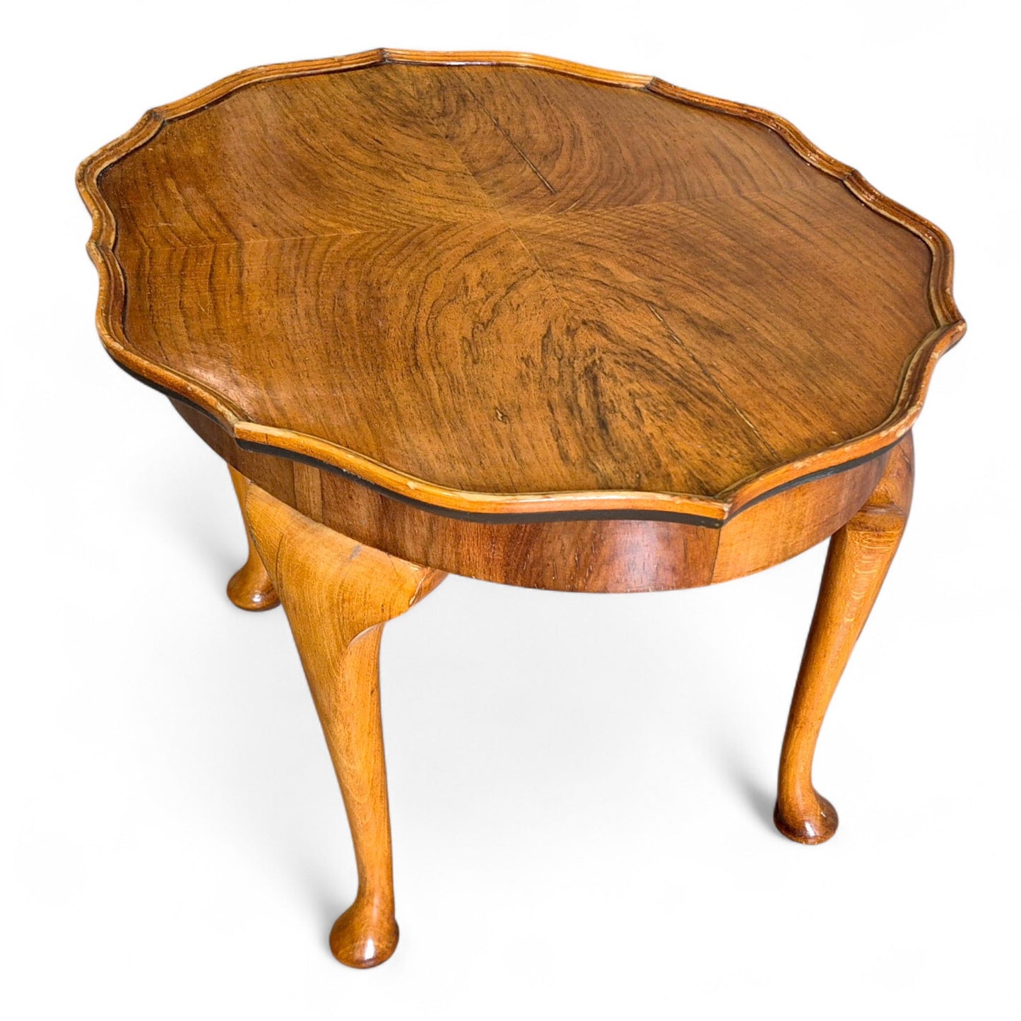 Restored vintage walnut coffee table with rich grain and warm patina