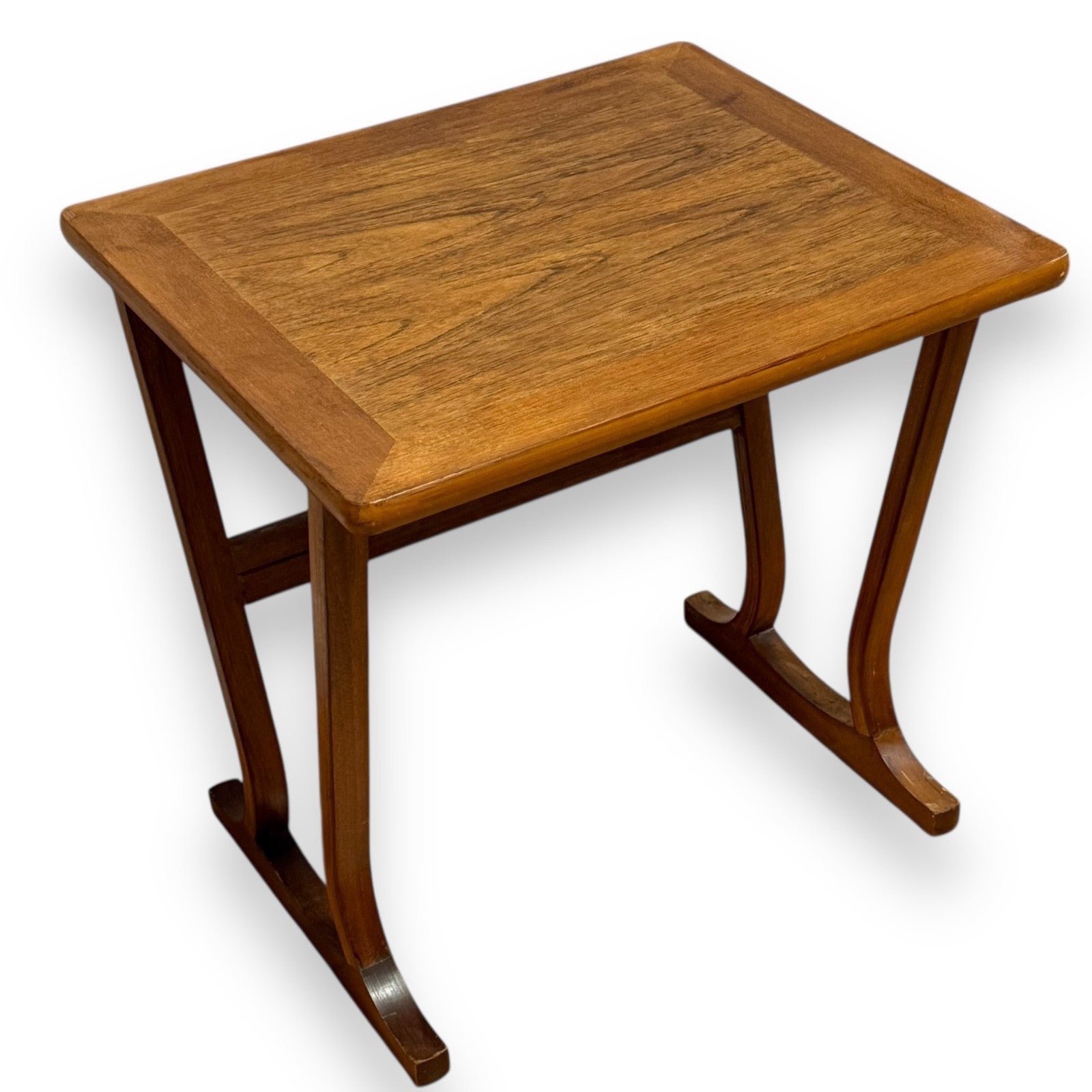 Mid-century teak coffee or side table by Parker Knoll with rectangular top, rounded edges, and splayed legs joined by a stretcher bar – elegant vintage design by Avego Antiques.