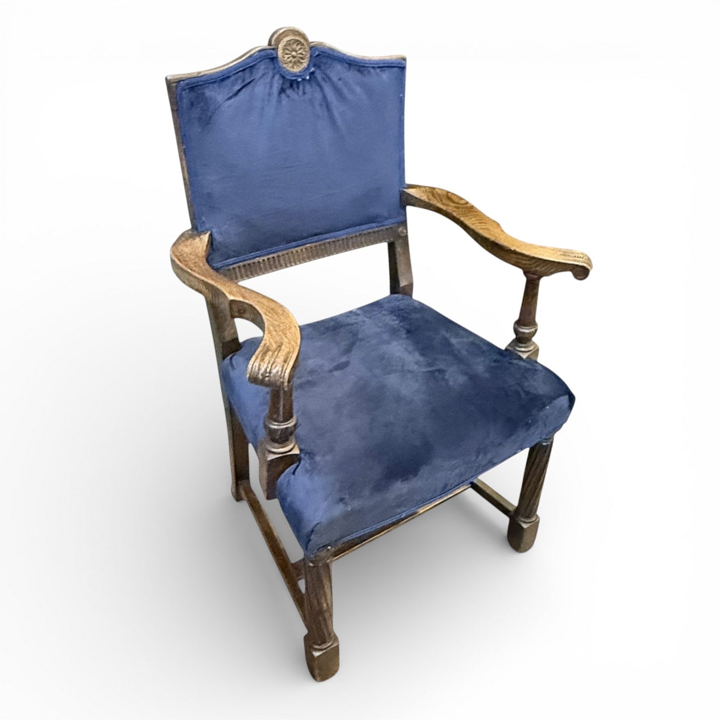 Antique oak carved upholstered armchair angled view