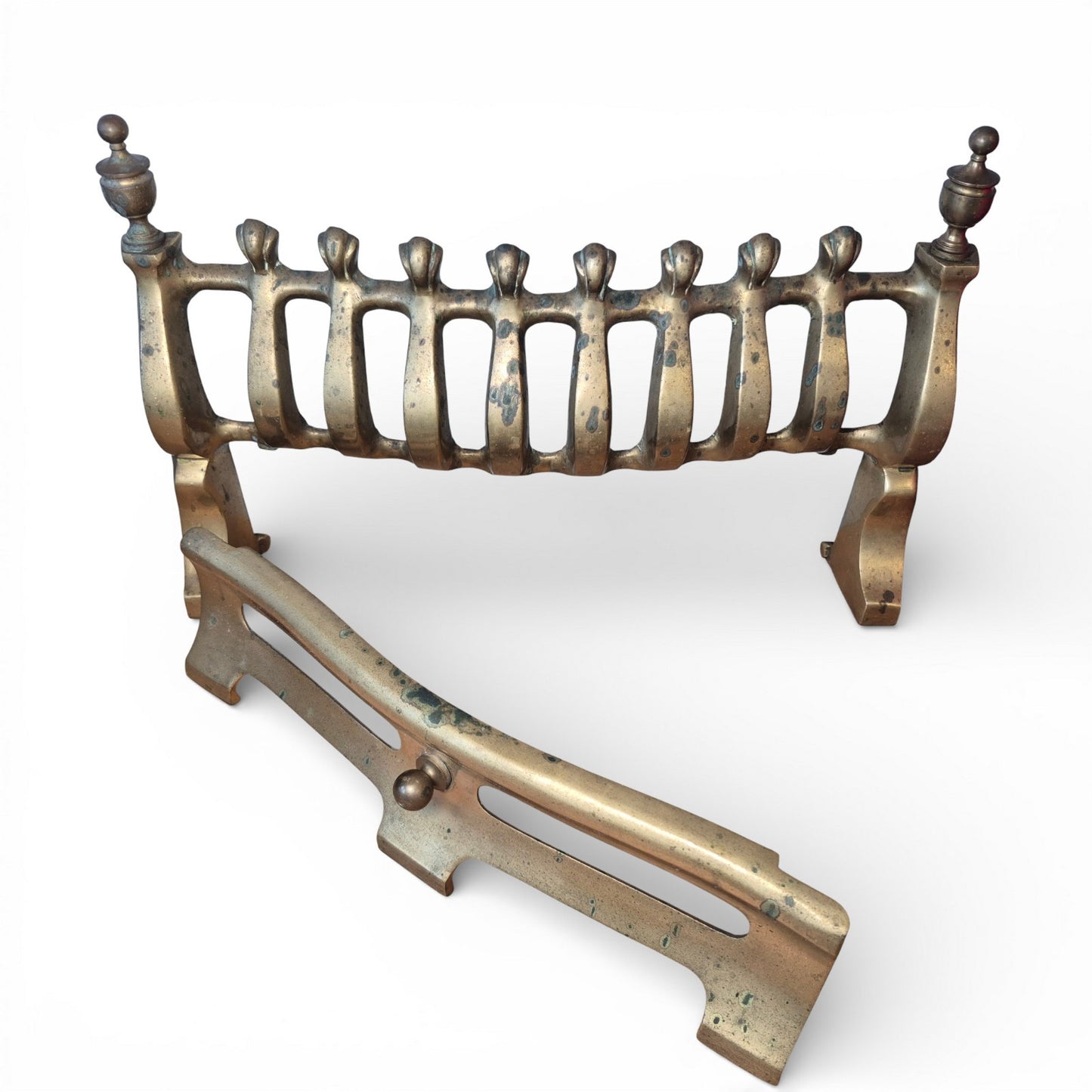 Detail of brass bars and aged patina on antique fire grate