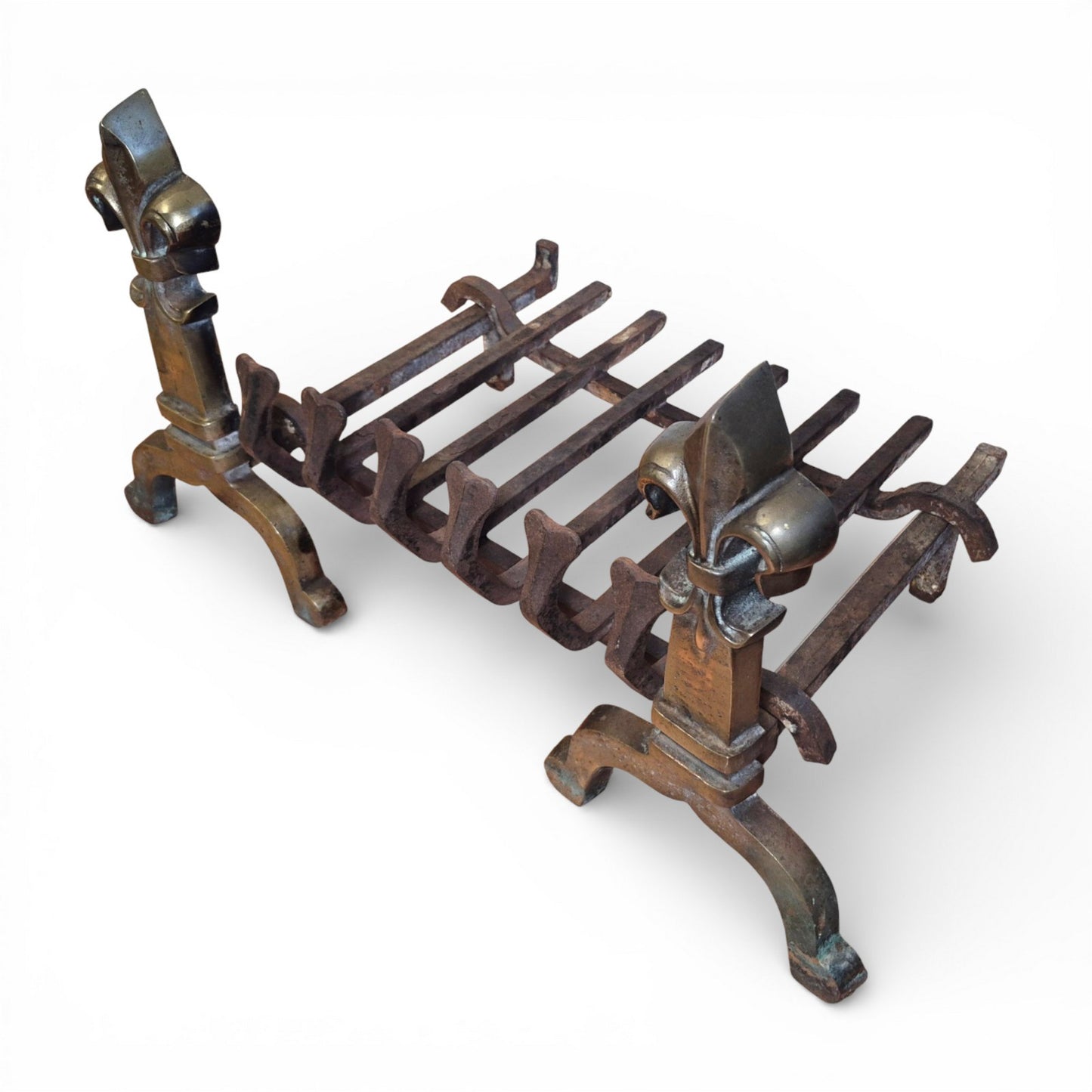 Side view of antique brass and iron fire grate