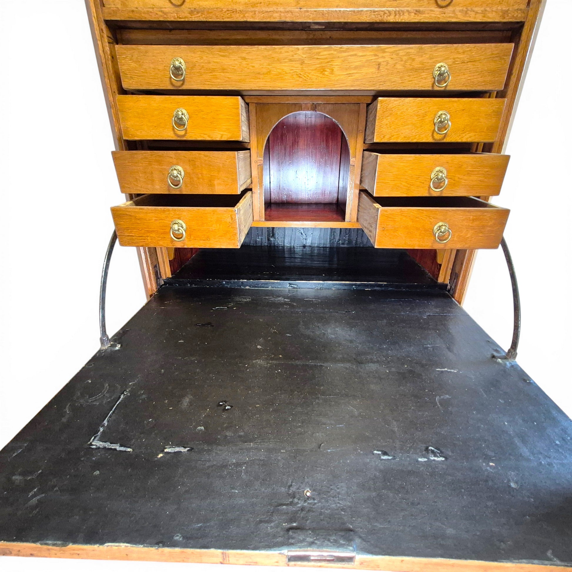 Interior of antique secretary desk with drawers and pigeonholes