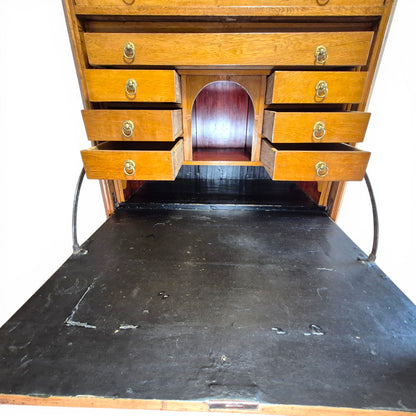 Interior of antique secretary desk with drawers and pigeonholes