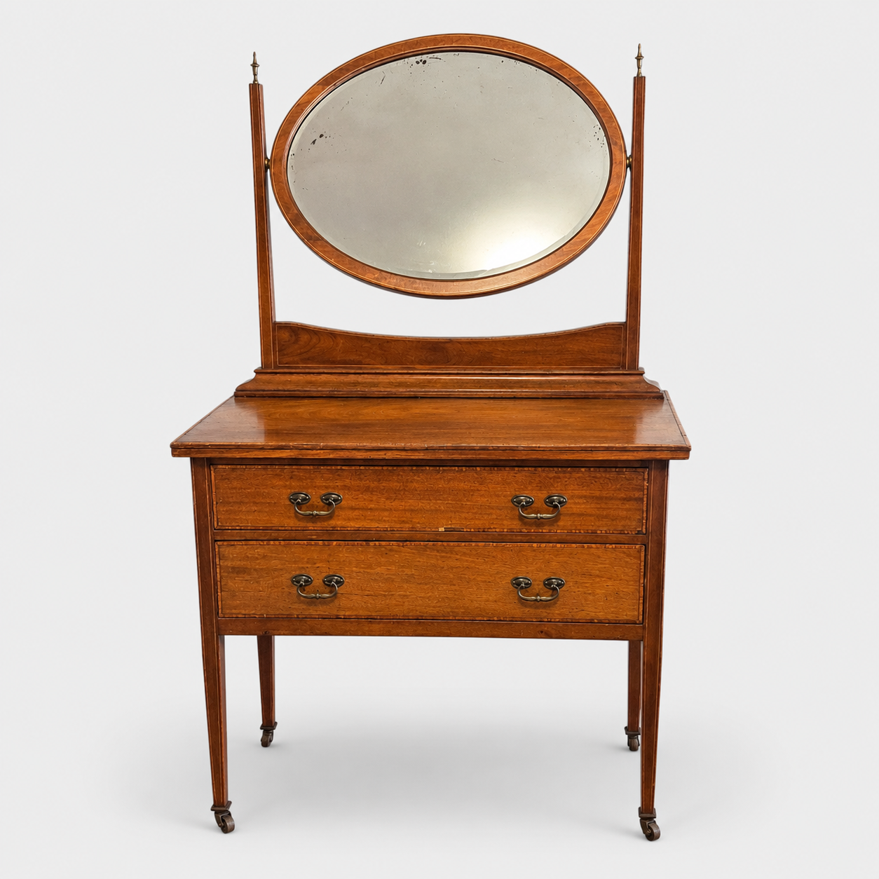 Antique Edwardian mahogany veneer dressing table with oval bevelled mirror and two drawers