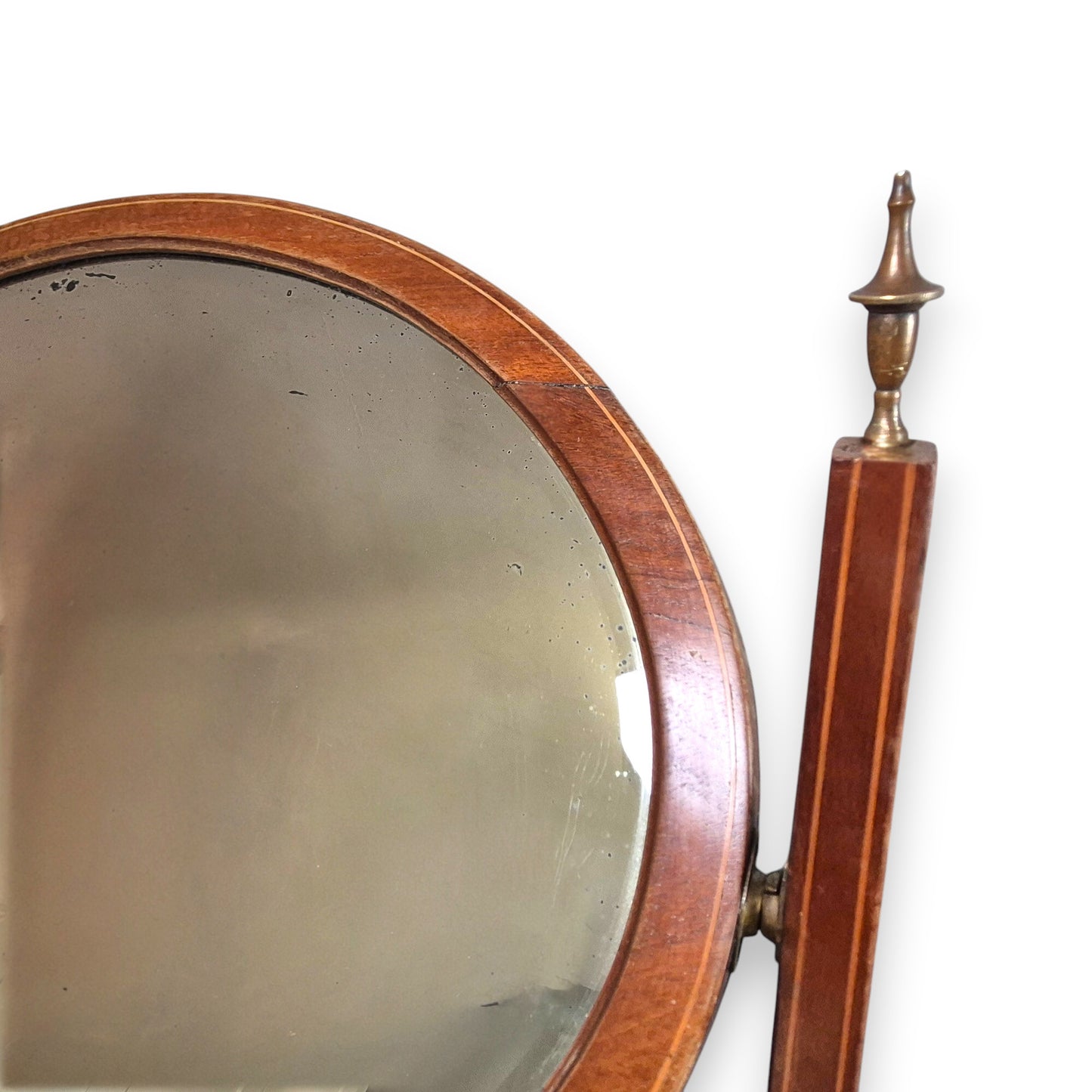 Edwardian mahogany dressing table with foxed oval mirror with brass finials.