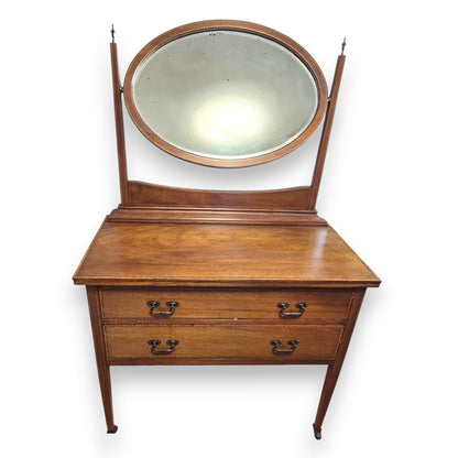 Antique bedroom vanity with mahogany veneer, raised swing mirror and tapered legs