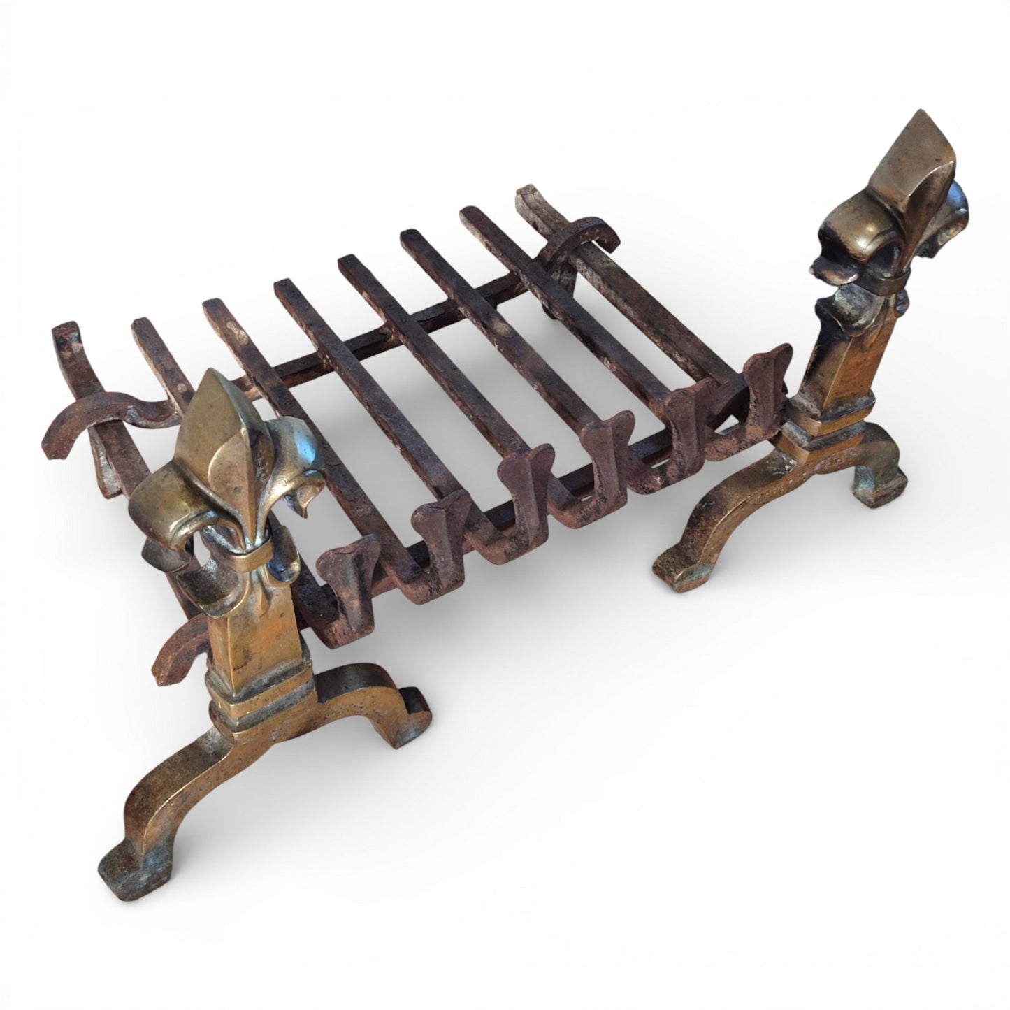 Antique fire grate with aged patina and surface wear