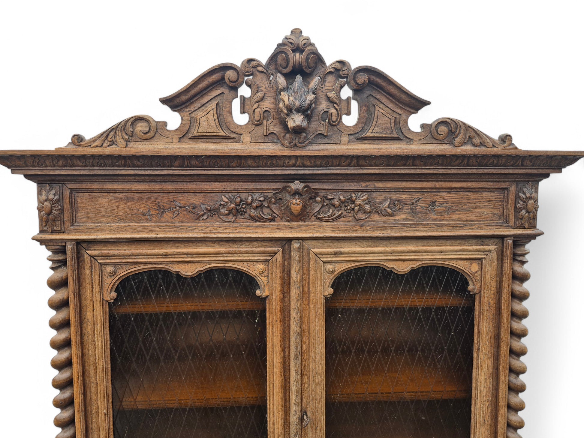 Upper cupboard of antique French oak dresser with carved panels and acrylic doors