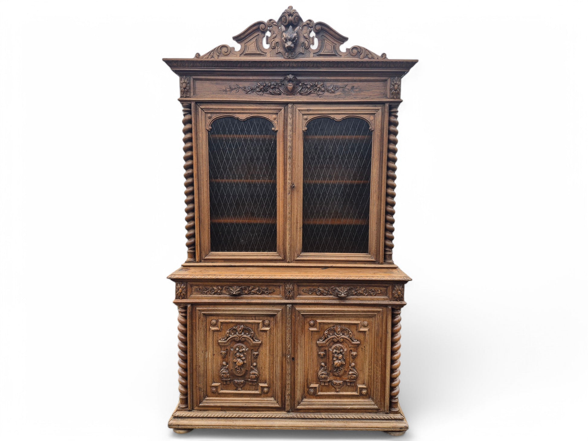 Antique French oak dresser with carved boar’s head pediment and twisted columns – late 1800s craftsmanship by Avego Antiques