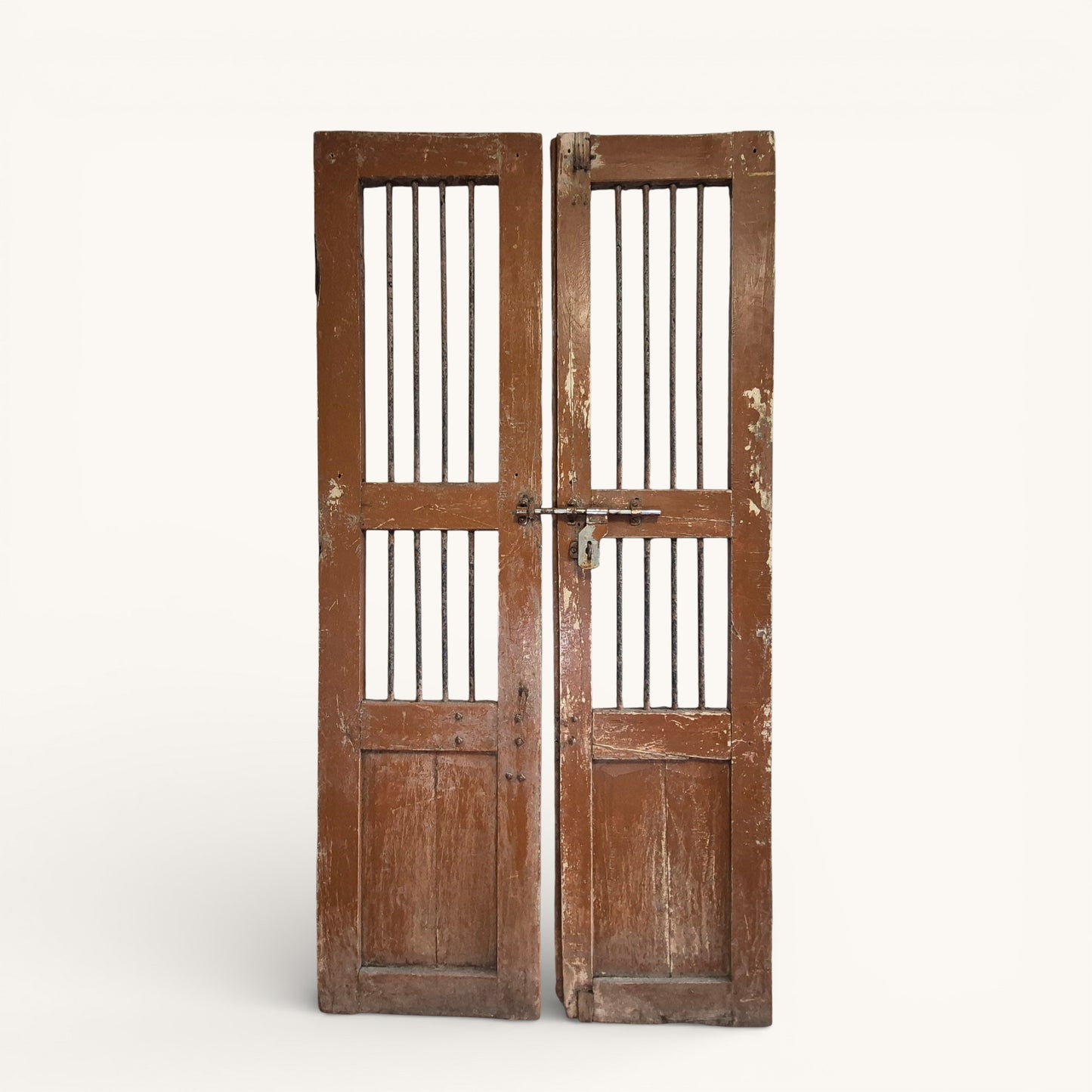 Close-up detail of original metal bolt and aged timber surface on antique Indian jali doors.