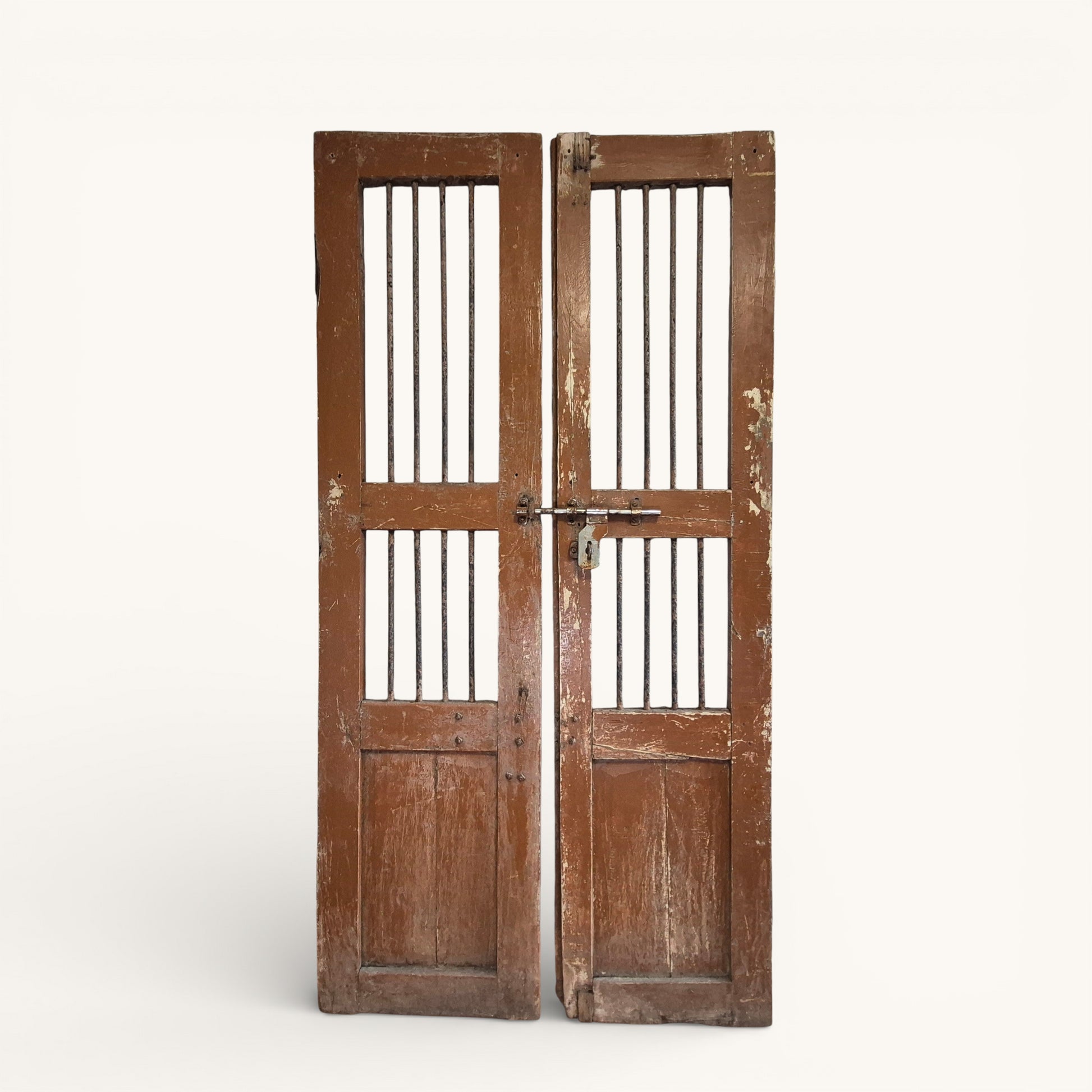 Close-up detail of original metal bolt and aged timber surface on antique Indian jali doors.
