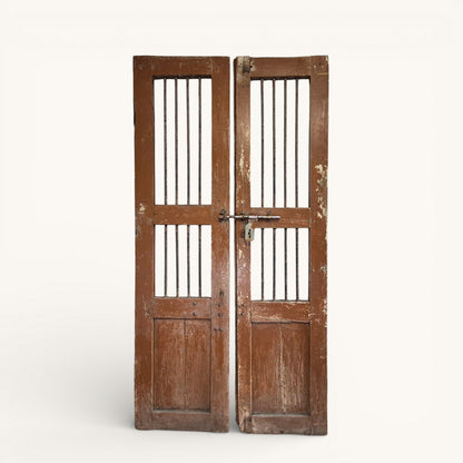Close-up detail of original metal bolt and aged timber surface on antique Indian jali doors.