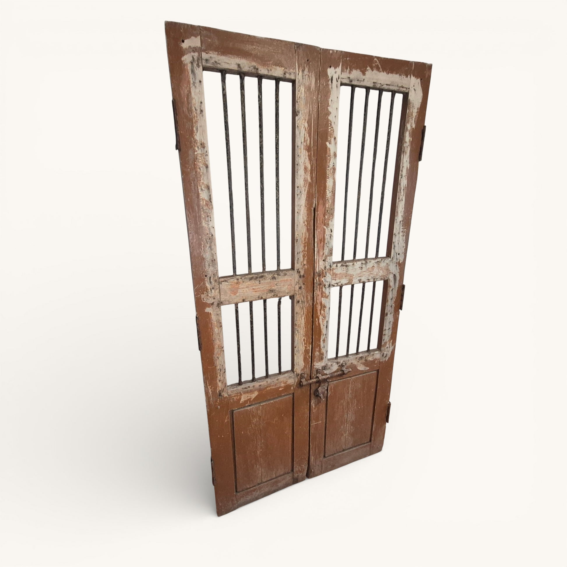 Pair of antique Indian jali doors with vertical iron bars and aged timber frames, 182cm tall reclaimed architectural salvage panels.