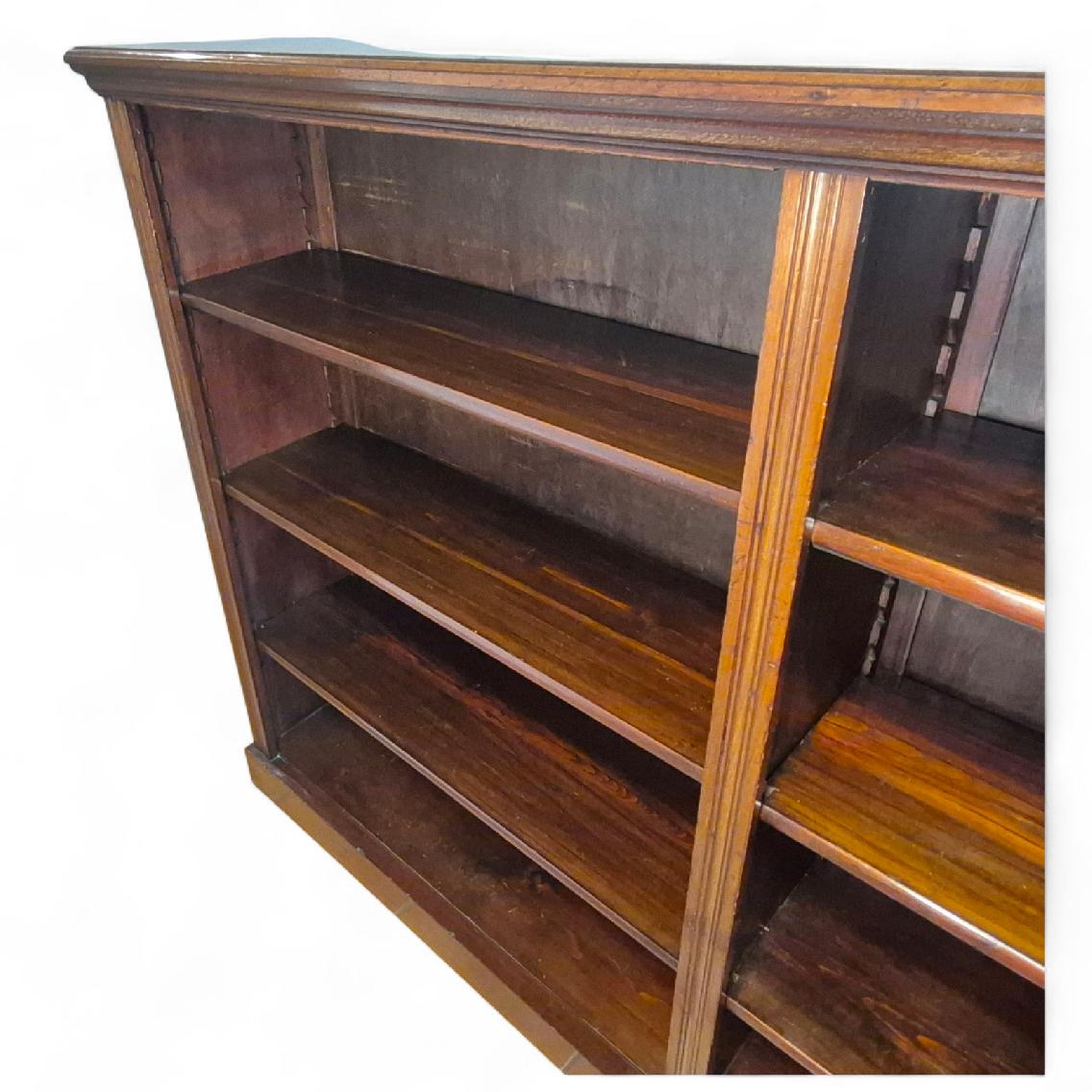 Adjustable shelf detail showing craftsmanship of antique mahogany open bookcase