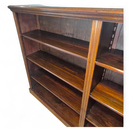 Adjustable shelf detail showing craftsmanship of antique mahogany open bookcase