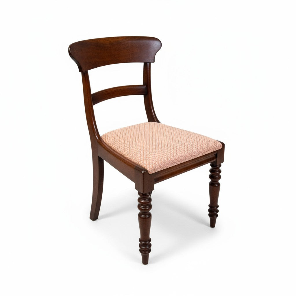 Close-up of Victorian mahogany chair showing curved back and turned legs