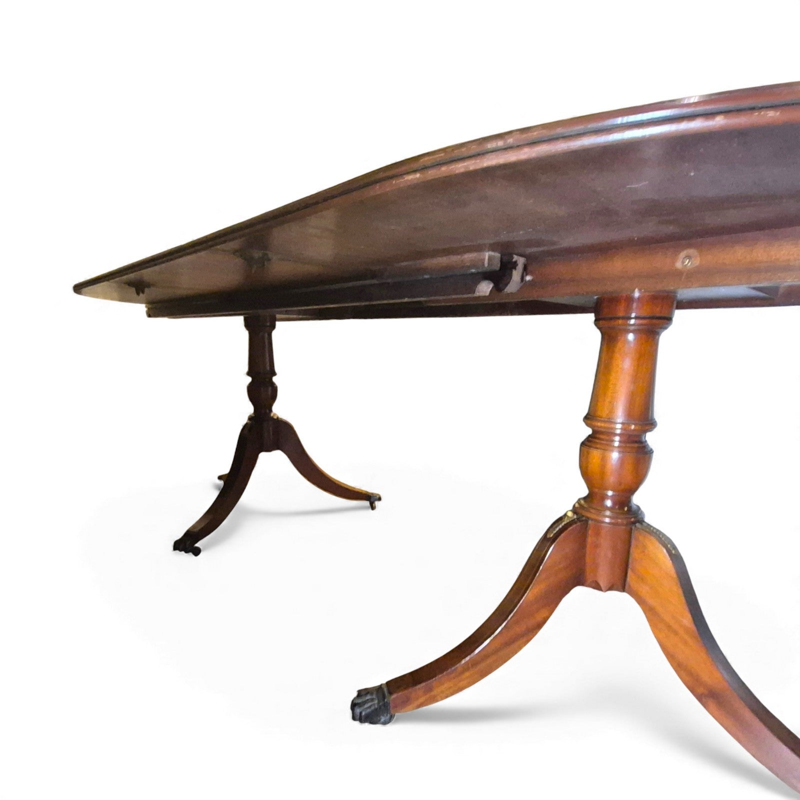 Showing underneath of twin pedestal bases with splayed legs, brass feet and castors