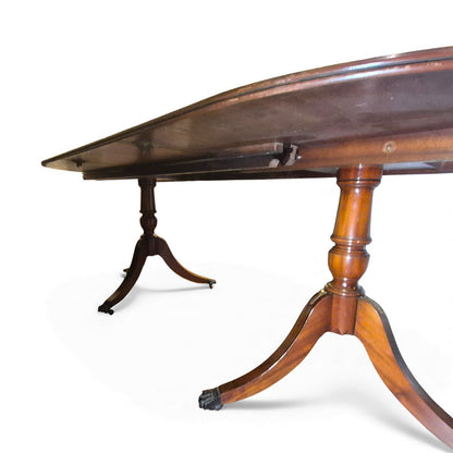 Showing underneath of twin pedestal bases with splayed legs, brass feet and castors