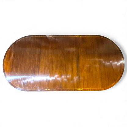 Regency mahogany dining table showing oval top and brass inlay edge