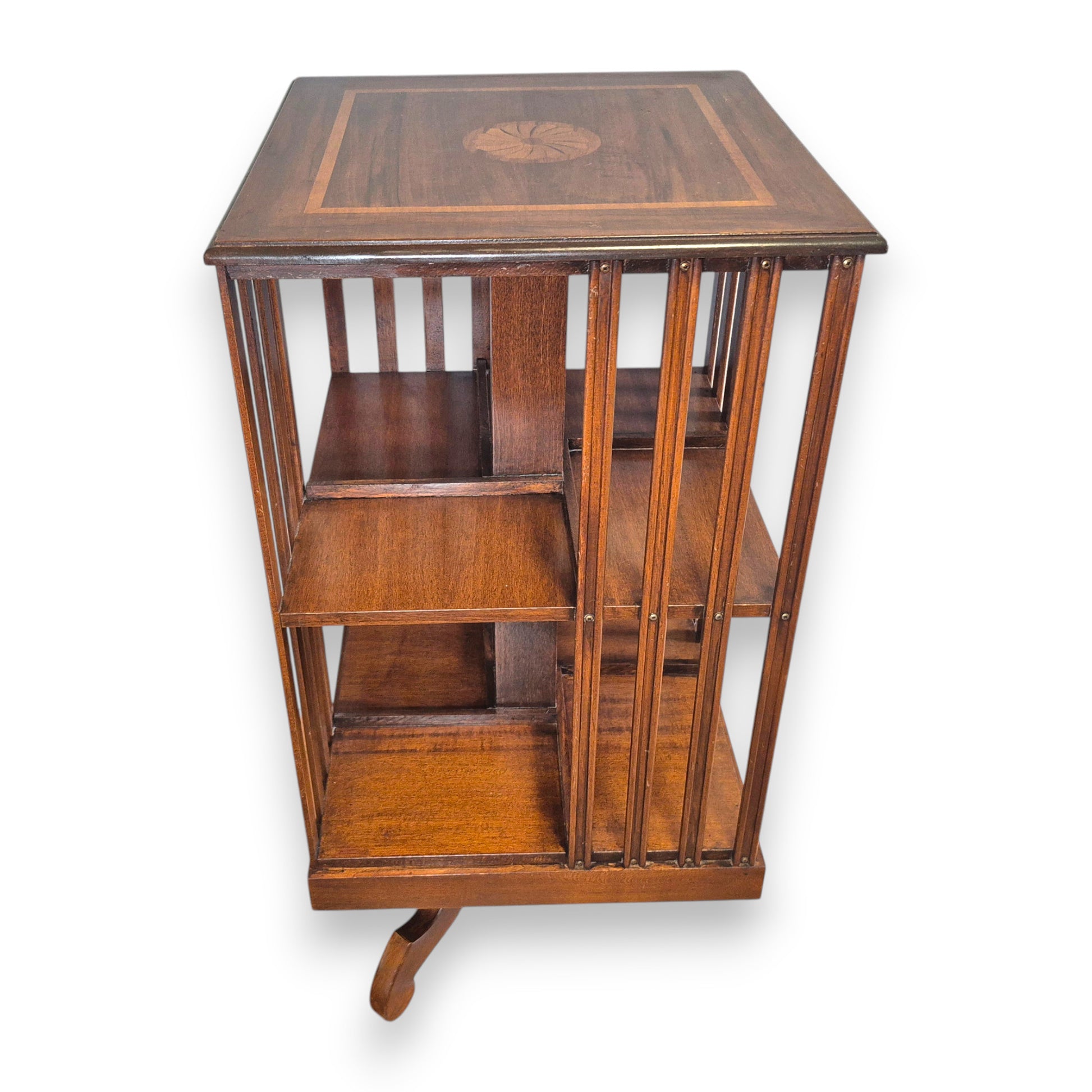 Edwardian mahogany revolving bookcase with open book storage