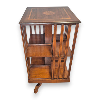 Edwardian mahogany revolving bookcase with open book storage