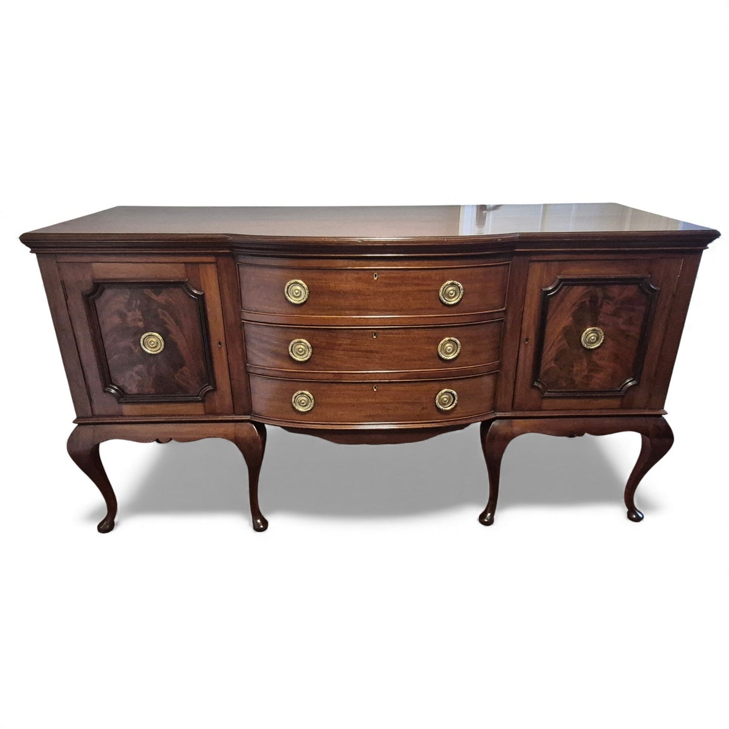 Antique mahogany serpentine-front sideboard with cabriole legs