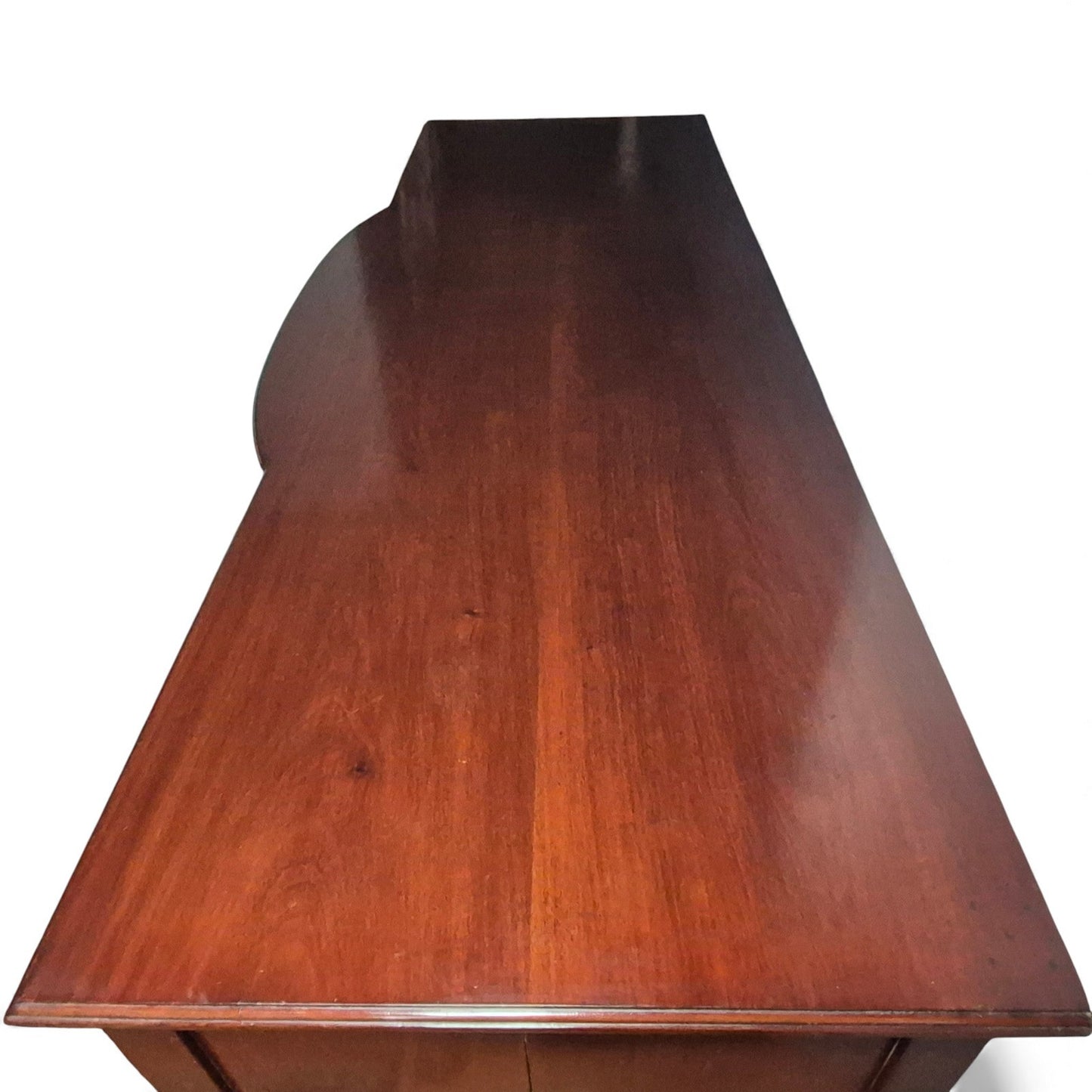 Top surface of antique mahogany sideboard showing aged patina