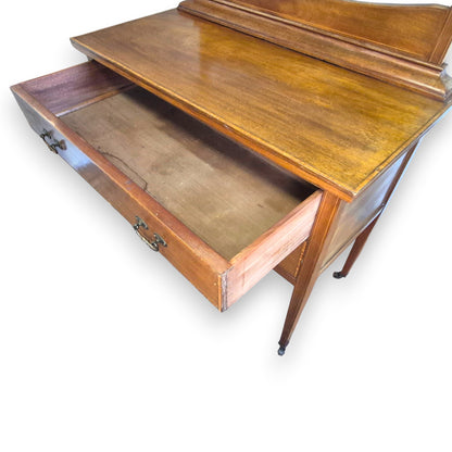 Mahogany veneer dressing table drawer detail with decorative inlay-style border and handle