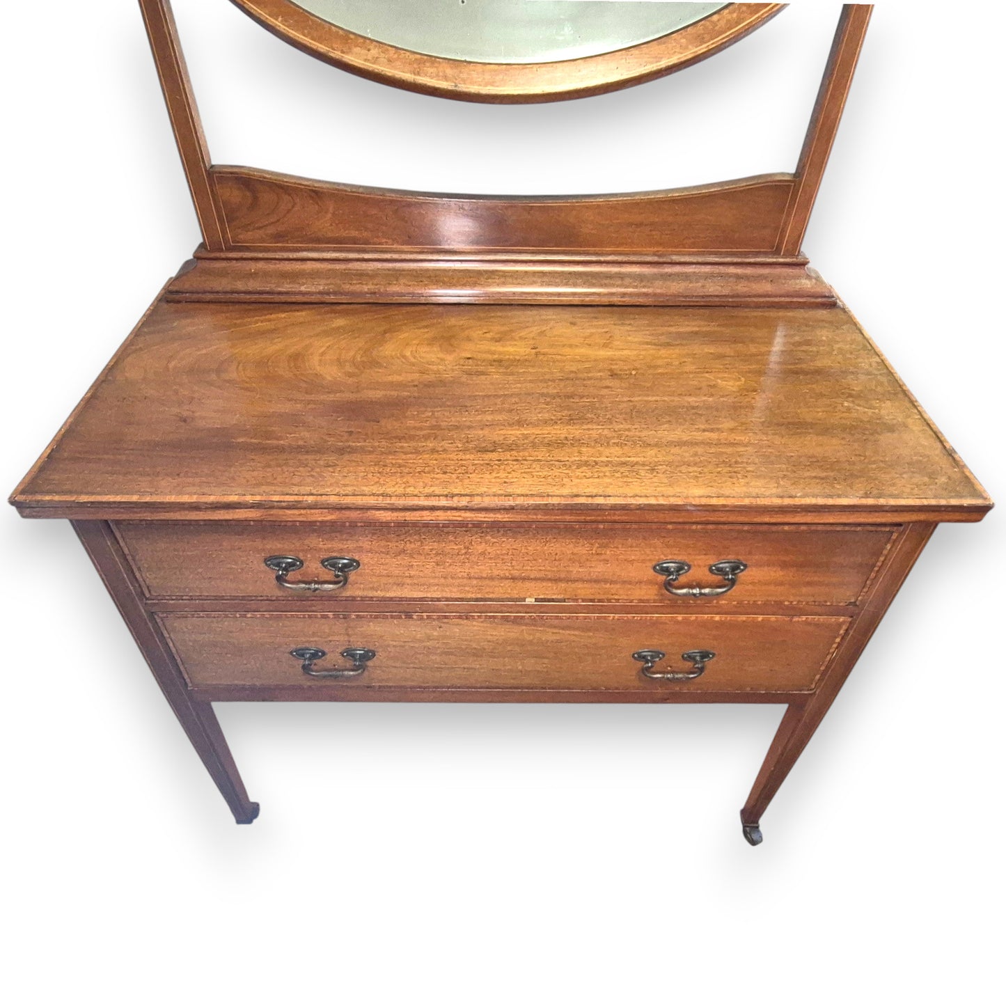 Antique Edwardian dressing table showing two drawers, slim legs and original castors