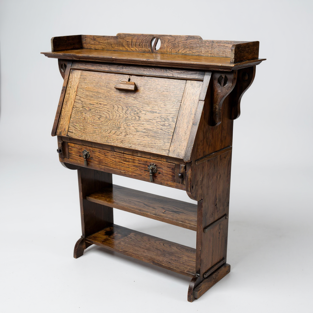 Arts and Crafts oak bureau – angled view highlighting rich patina and side detailing