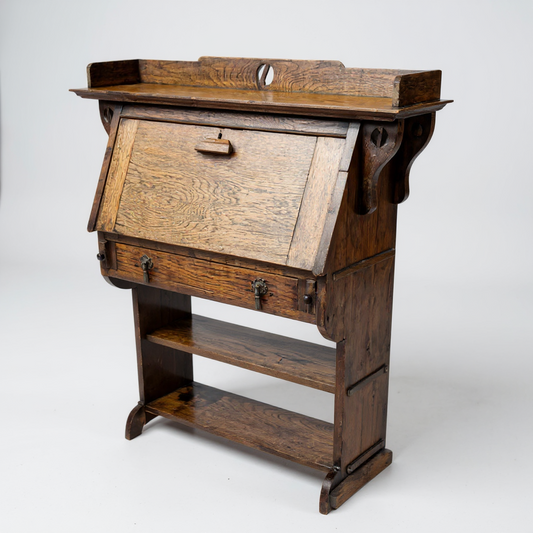 Arts and Crafts oak bureau – angled view highlighting rich patina and side detailing