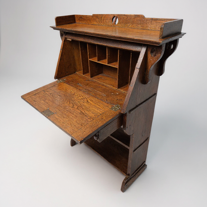 Oak bureau writing desk – drop-front open showing interior compartments