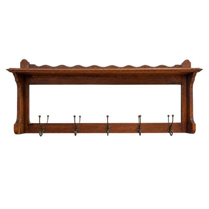 Antique oak wall mounted coat rack with mirror shelf and cast iron hooks