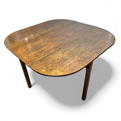 Antique oak drop-leaf kitchen table with plank top and rustic patina