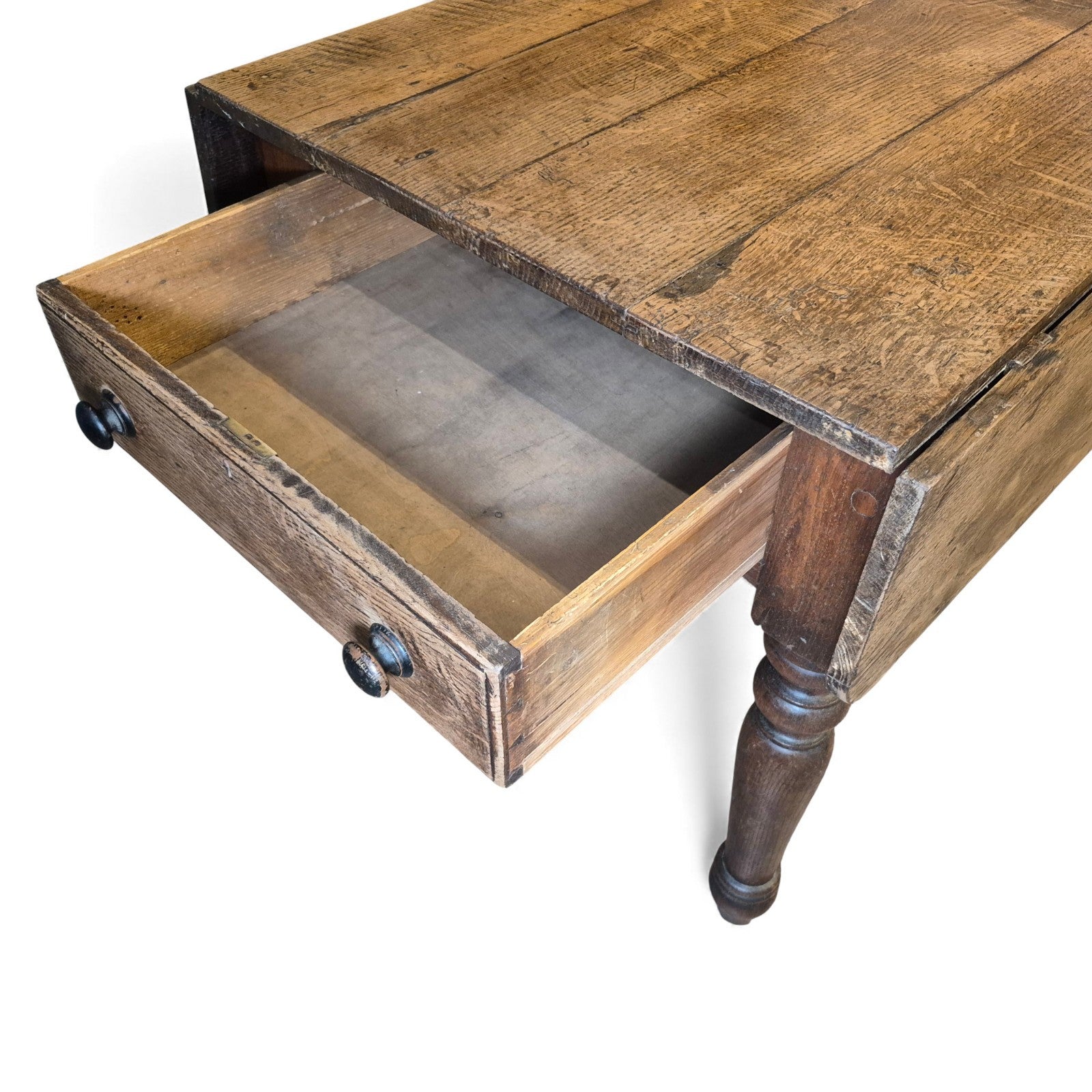 Close-up of open drawer and the aged oak plank top showing grain and natural patina