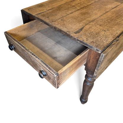 Close-up of open drawer and the aged oak plank top showing grain and natural patina