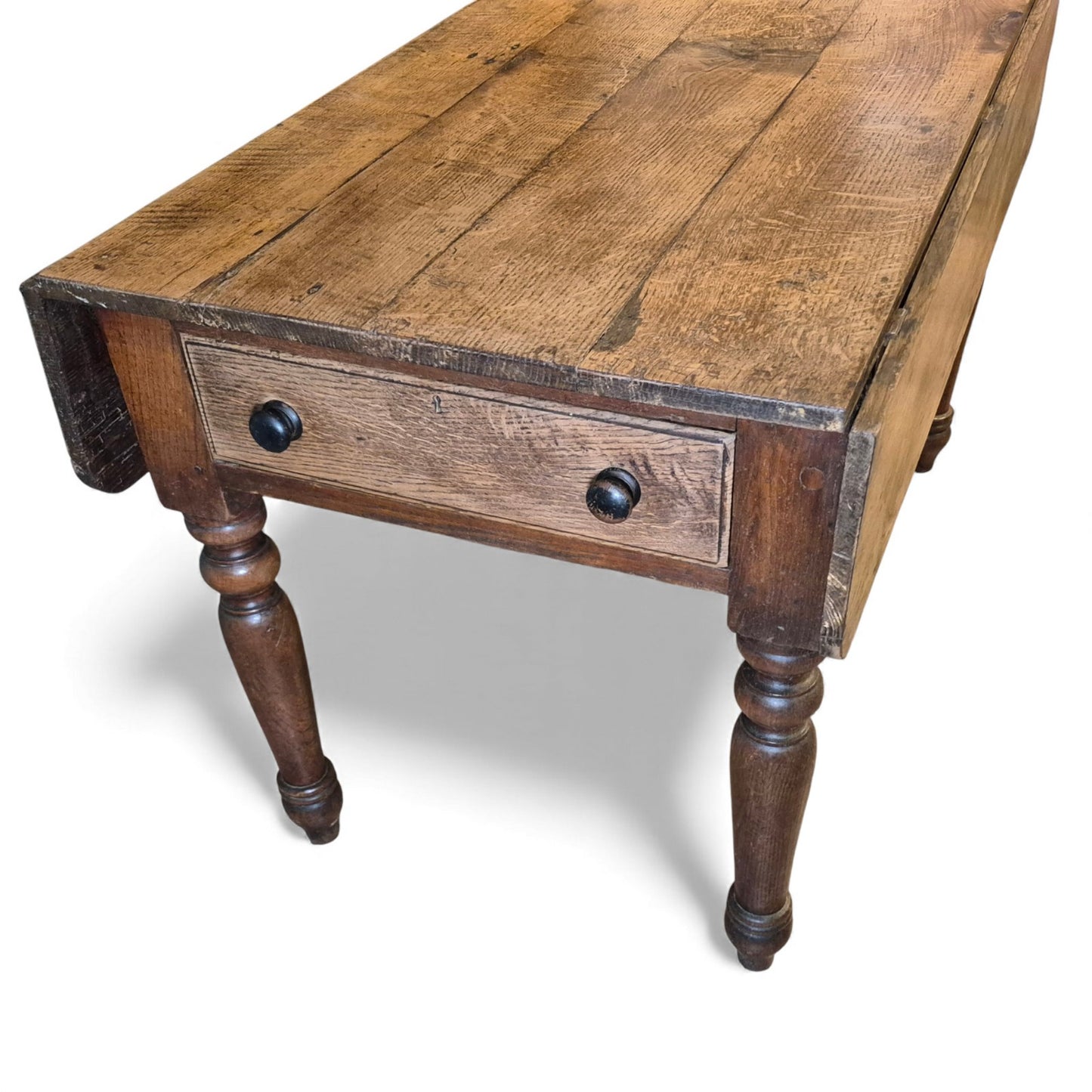 Antique oak table with dual drawers and turned leg base