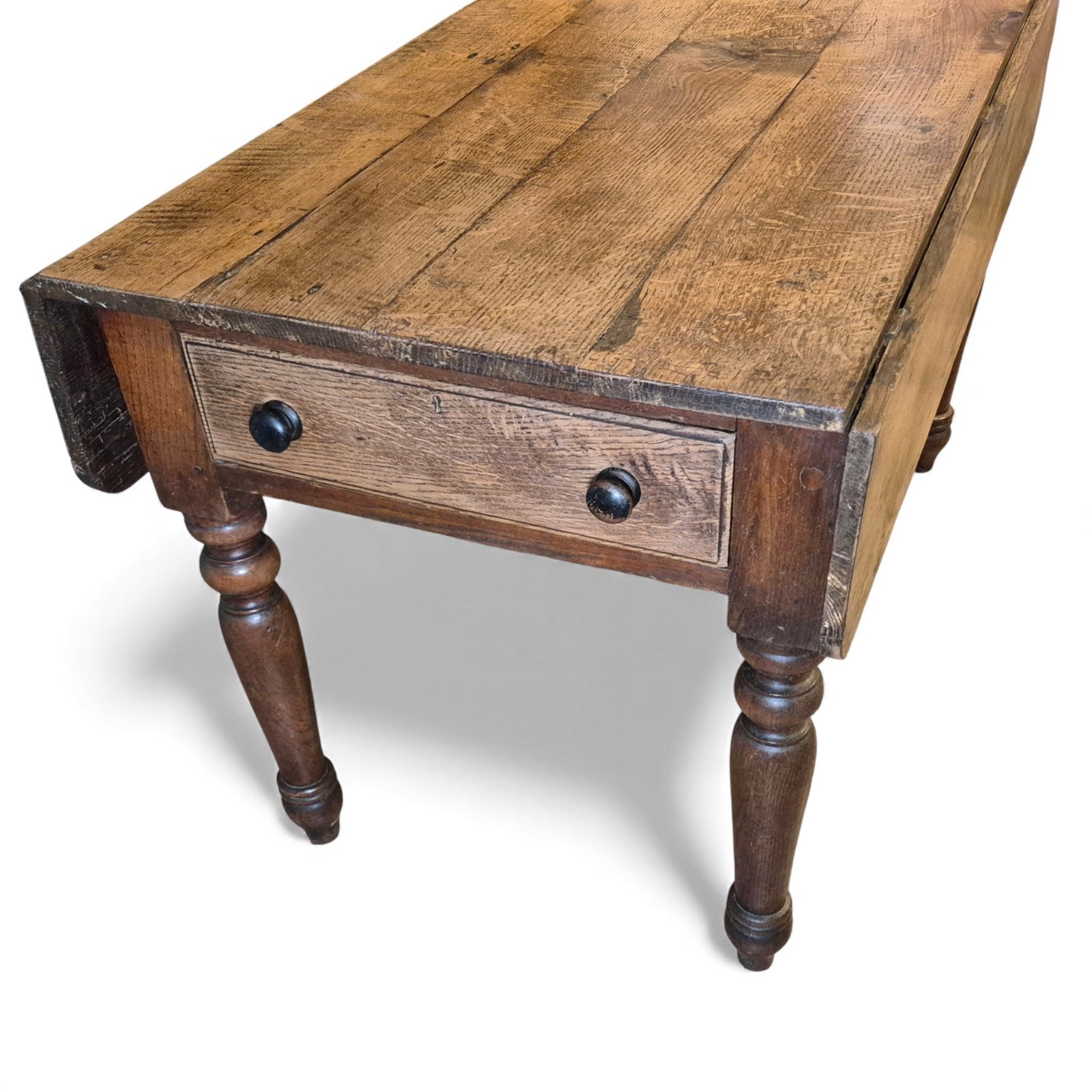 Antique oak table with dual drawers and turned leg base