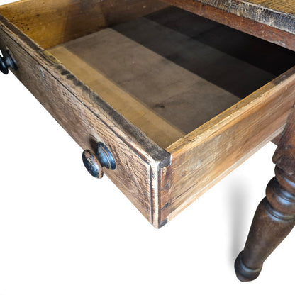 Side view of oak farmhouse kitchen table open drawer