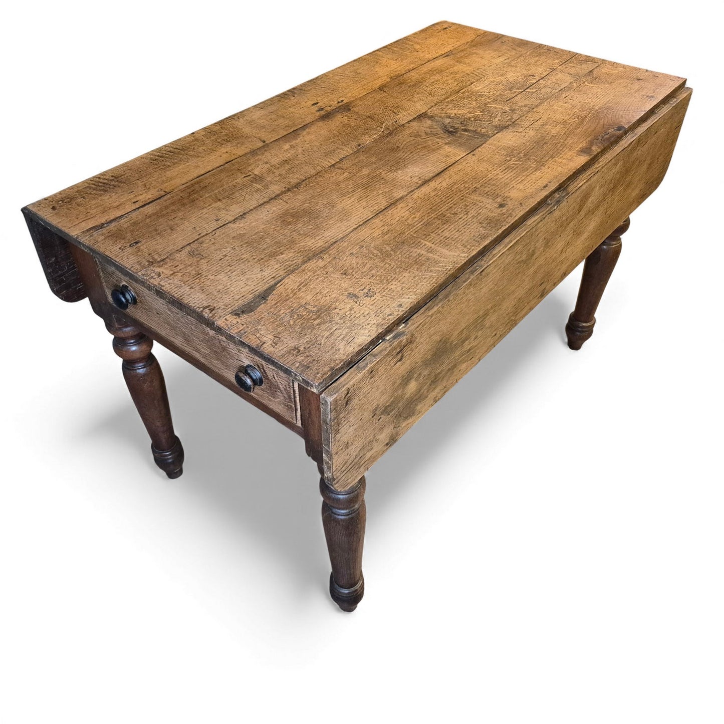 Side view of oak farmhouse kitchen table with leaves down