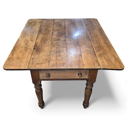 End shot of aged oak plank top showing grain and natural patina