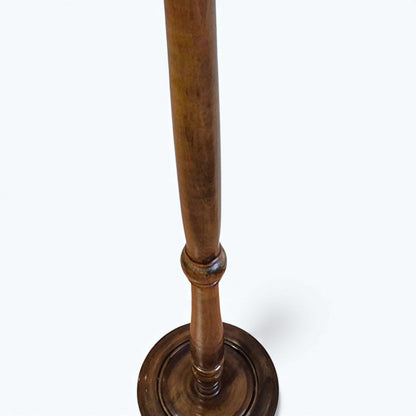 Antique oak floor lamp showing turned column and circular base
